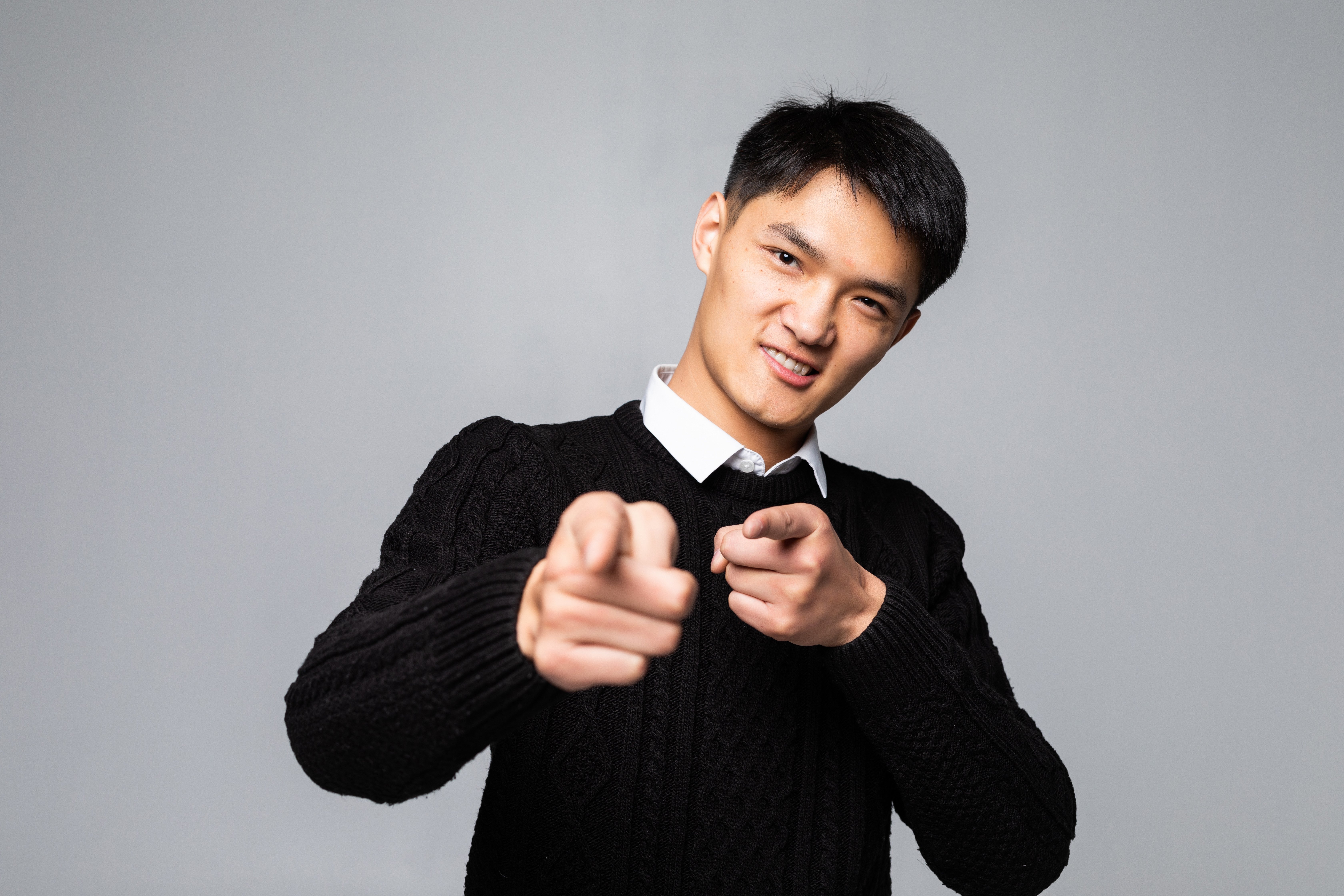 portrait-chinese-man-points-finger-you-isolated-white-wall